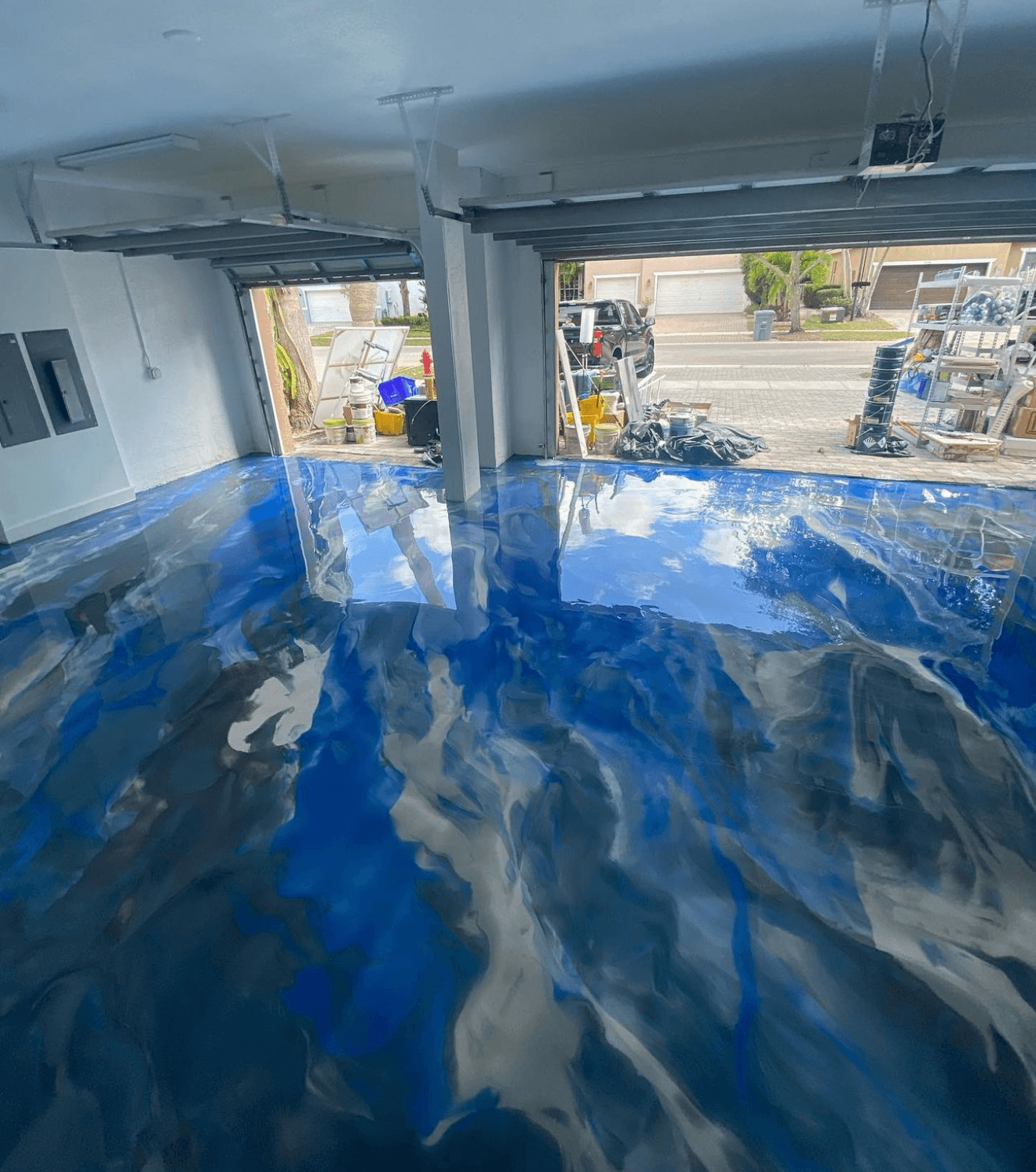 Blue metallic epoxy floor in garage